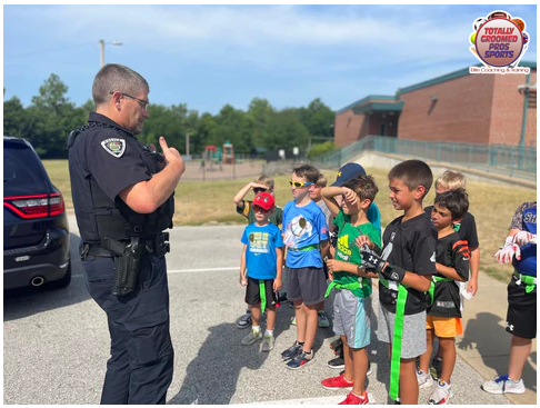 Officer Matt Stops by TGP Football Camp